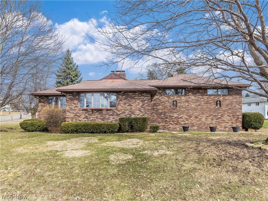 Welcome to this 5 bedroom 2 1/2 bath all brick home located in the Charity Rotch area of Massillon. Walking into the foyer you are greeted with a beautiful brick and wood accent wall. The living room has a double sided gas fireplace with brick hearth, large bay window and is open to the dining room with an additional bay window for abundant natural light. The kitchen has all of the appliances you will need plus a double sink with a window overlooking the back yard. There is a convenient large laundry room with washer, dryer, sink, folding table and plenty of storage. The family room shares the double fireplace and comes with a wall mounted television and access to the large glass enclosed sun porch that overlook the mature trees of the backyard. The master bedroom has a ceiling fan, large closet and boasts a half bath. There are two additional bedrooms each with large closets and a full bath on this level. On the lower level there are two additional large rooms that are connected by a