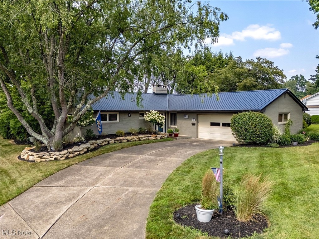 This beautifully updated ranch offers the perfect blend of privacy, charm, and convenience—all on a spacious corner lot in the heart of North Canton. Situated right next to the brand-new North Canton Intermediate School, the home enjoys open fields behind it and the benefit of having minimal nearby neighbors. Inside, you'll find a bright and welcoming layout with major updates throughout. The kitchen has been fully renovated with new cabinets, appliances, and flooring, and the interior has been freshly painted. A wood-burning stove and chimney insert add warmth and character to the living room, creating a cozy space to relax. Outside, the curb appeal shines with updated landscaping, fresh exterior paint, and a durable metal roof. All of these improvements have been completed in the last few years, making this home truly move-in ready. The corner lot provides extra outdoor space and privacy, all while being just minutes from parks, schools, shops, and restaurants. This is a rare opportunity to own a well-cared-for home with quality updates in addition to around 1,400 sq ft of finishable space in the basement! Call or text today to schedule your private showing.