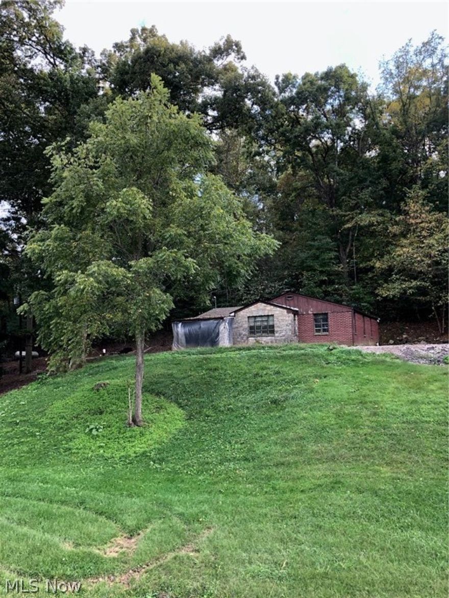 Darling cottage On 5 acres. 2 bedrooms. 1 bath. Loads Of character and charm. Stone and brick exterior. 2 porches. Nice laundry room. Realtor related To seller.