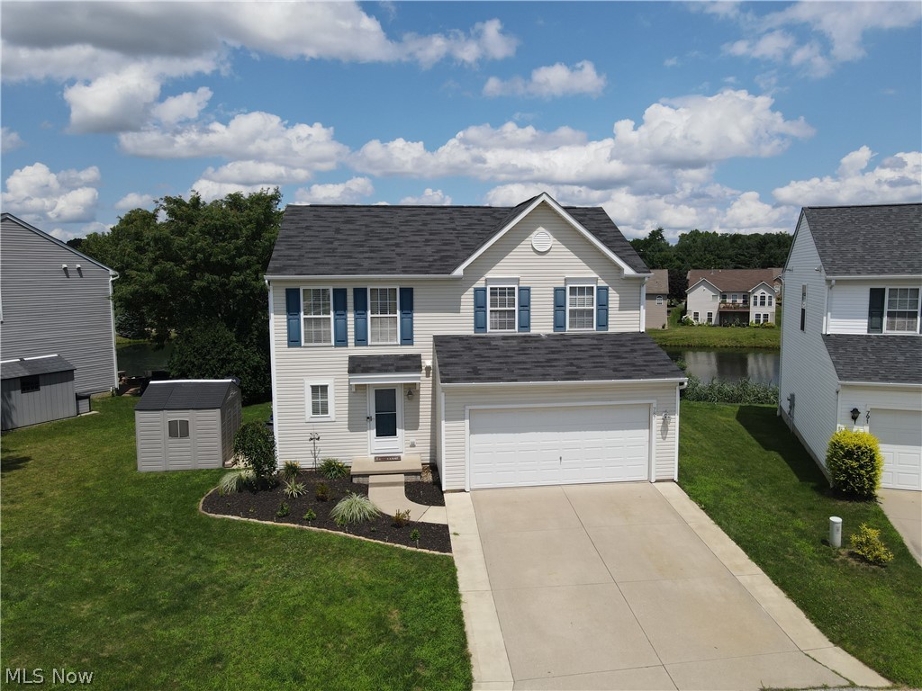 Don’t miss this beautifully maintained colonial, with a gorgeous water view, located in the desirable Pleasant Lakes Development! Upon walking through the front door, you are greeted by an open floor plan with a spacious entryway that flows seamlessly toward the large living room. The fully applianced eat-in kitchen is beautiful and bright with fantastic views of the lake from the kitchen sink and the kitchen table! The main floor features a sizable walk-in pantry, convenient mud room, built-in coffee bar, half bath, and closet space. Wonder upstairs to find a huge Master Suite with more amazing views, attached full bath and fantastic walk-in closet. Two good sized bedrooms, additional full bath, and roomy laundry room (including washer/dryer 2021) complete the second floor. The partially finished basement provides extra living space, plenty of storage, and rough-ins for an optional future bathroom. The large rear yard composite deck AND hot tub offer a breathtaking view of the tranquil pond and awesome wildlife – the perfect way to unwind after a long day! Updates include: Insulated 2 car garage with heater, 12x14 pad on side of house with 8x10 resin shed, water softener system, dishwasher (2023), stove (2023), composite decking (2023), Hot Tub (2022), 50 gal Hot Water Tank (2023), FURANCE AND A/C (2023). Close to Kent State University, downtown Kent, I-76, and more!