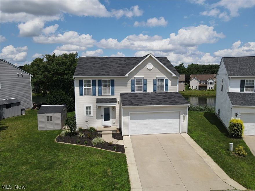 Don’t miss this beautifully maintained colonial, with a gorgeous water view, located in the desirable Pleasant Lakes Development! Upon walking through the front door, you are greeted by an open floor plan with a spacious entryway that flows seamlessly toward the large living room. The fully applianced eat-in kitchen is beautiful and bright with fantastic views of the lake from the kitchen sink and the kitchen table! The main floor features a sizable walk-in pantry, convenient mud room, built-in coffee bar, half bath, and closet space. Wonder upstairs to find a huge Master Suite with more amazing views, attached full bath and fantastic walk-in closet. Two good sized bedrooms, additional full bath, and roomy laundry room (including washer/dryer 2021) complete the second floor. The partially finished basement provides extra living space, plenty of storage, and rough-ins for an optional future bathroom. The large rear yard composite deck AND hot tub offer a breathtaking view of the tranquil pond and awesome wildlife – the perfect way to unwind after a long day!  Updates include: Insulated 2 car garage with heater, 12x14 pad on side of house with 8x10 resin shed, water softener system, dishwasher (2023), stove (2023), composite decking (2023), Hot Tub (2022), 50 gal Hot Water Tank (2023), FURANCE AND A/C (2023).  Close to Kent State University, downtown Kent, I-76, and more!