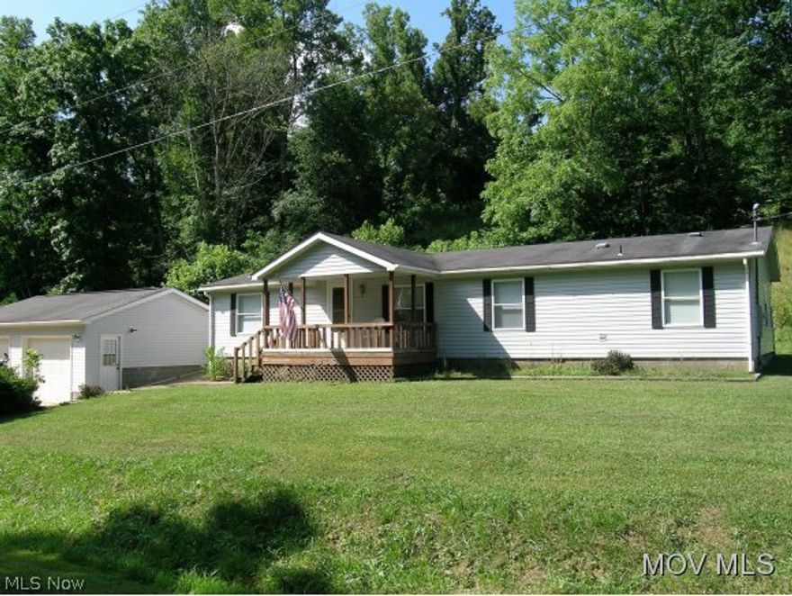 See this 1994 doublewide on a permanent foundation, taxed as real estate.Great Room concept, open flowing floor plan with wood burning fireplace infamily room. Some Hardwood floors, tile entry,formal dining, eat in kitchen. 3bedrooms 2 full baths, central air& gas forced air heat. 2 car garage all on 13+ acres. Handicap ramp if needed. Possession at closing, just outside Belpre  Elem: Belpre Elementary School  Elem/Bus: Y  JrHigh: Belpre Middle School  JrHigh/Bus: Y  High: Belpre High School  High/Bus: Y  Fire: VOL  Police: SHF  PossFreeGas: N  ;SQFT=Fin L1:1512, Fin Bsmt:0, Fin Above:1512, Fin Total:1512, Unfin L1:0, Unfin Bsmt:0, Unfin Above:0;GAR= 2 Car Att, Opener(s)