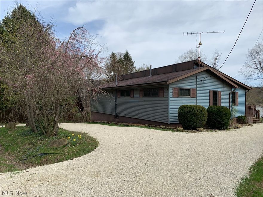 This three bedroom awesome ranch home on Seneca Lake with views across the water is move in ready.  Beautiful wood floors in most of the first floor living area and an open concept will make this home go quickly.  Perfect for a second home on the water to come and relax and enjoy the beauty of lake living, or for year round primary use.  Either choice you won't regret the location.  The dock will sit just inside the no wake area close to the marina.  Comes complete with an EZ dock system already installed.  The screened in porch has entry from the living room or the master bedroom with views out to the water.  Or enjoy grilling from the open deck off of the living room.  The walk out lower level has laundry, a family room or additional bed space, access to the storage space and garage.  There is an unfinished full bath roughed in and ready with most of the supplies to hook up and install.  The large yard is perfect for gatherings or just quiet relaxation next to the lake.   With two dr