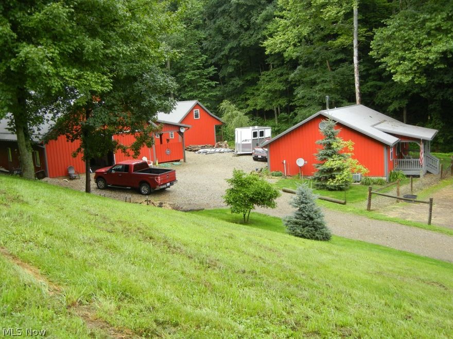 Great private horse property! Low maintenance metal Amish built buildings tucked back off the road. 2 bedroom home with hickory kitchen and woodburner. 16x20 furnished cabin with woodburner and loft. 30x50 four stall horse barn with 10' canopy with heated shop, tack, and bath rooms plus unfinished upstairs. Outdoor arena, 3 pastures w/equine fence with electric on top, loafing shed, tractor shed, woods, and stream. Can turn average gooseneck. Come take a look! Additional land available (from different owners). $120/month electric average (w/woodburner use).