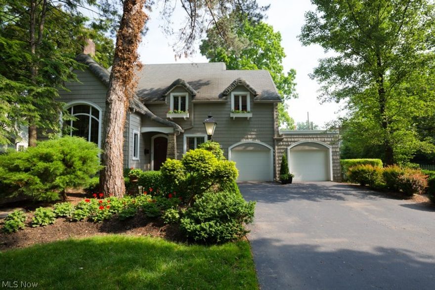 History and design come together in this stunning Norman Tudor house in the Washington Avenue area. Original details like leaded glass windows, ornate fireplace, a wrought iron staircase, plaster moldings, and lovely wood trims have been thoughtfully incorporated into a truly tasteful and up-to-date living space. The first floor includes a grand foyer, updated kitchen with top-of-the-line stainless appliances, breakfast nook/office, a sleek bathroom, formal dining room, comfortable den, and the place that will be your favorite room in the house, the jaw-dropping living room with a 17-foot ceiling and an enormous leaded window. The current owners plan to include the 10’ Christmas tree they display there every year.  Spend your summer days on the three-season porch overlooking the gorgeous landscaped backyard. Upstairs are 4 detail-filled bedrooms and an updated full bath.  There’s plenty of storage in the attic and basement. Central air.  Here’s your chance at a one-of-a-kind property.