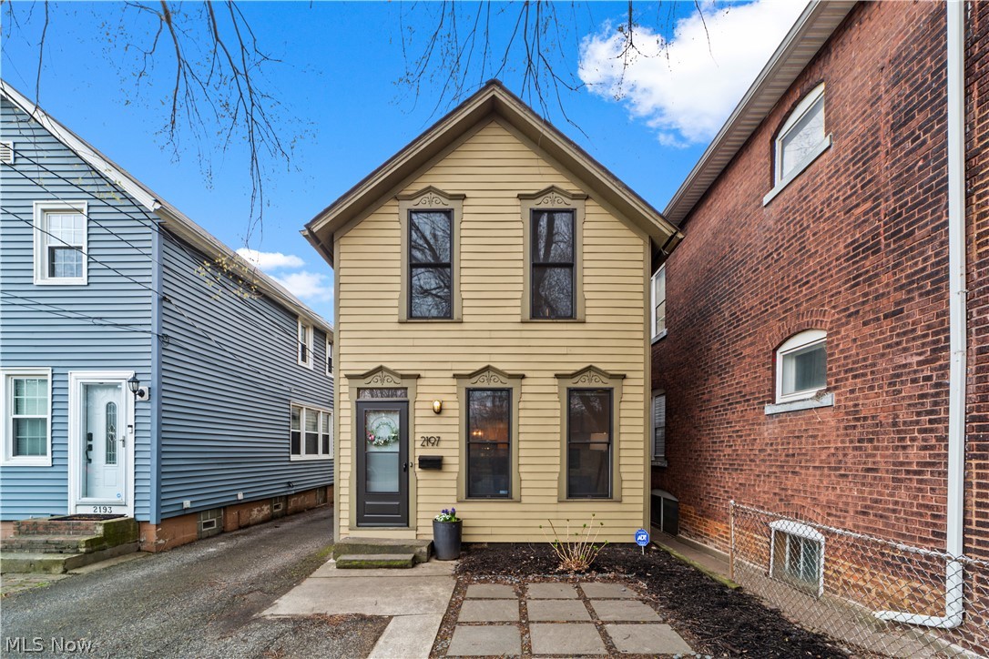 Wow! Move right into this charming colonial in the popular Duck Island neighborhood of Cleveland! This beautifully cared for home features over 1800 square feet of living space with 3 bedrooms, 2 full bathrooms, spacious open-plan living areas, a private back yard, and more! As you approach the home you are greeted by front patio and a beautiful facade that boasts original woodwork. Step inside to the welcoming living room that features a lovely fireplace, plenty of natural light, and hardwood flooring that flows throughout the home. The living room is open to the dining room which flows into the kitchen. Here you will find a full complement of appliances, a breakfast bar, and plenty of cabinet space. A full bathroom completes the first floor. Upstairs, there are two generously-sized bedrooms, both with ample closet space and hardwood flooring. The second floor landing includes a laundry closet and a desk area that is illuminated by a lovely skylight. A full bathroom with a step-in shower and soaking tub completes the second floor. Upstairs, the third bedroom is setup nicely as a sitting room / office. Here you will find plenty of windows and another skylight! Fantastic Duck Island location just moments away from some of Cleveland's finest restaurants and nightlife, and just across the bridge from Downtown! Don't miss this one!