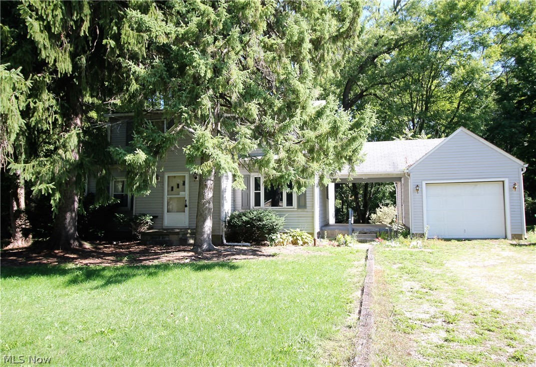 Endless possibilities right here with this three bedroom, one full bath home on almost an acre lot. This home has plenty of charm that just needs someone to use their personal touches. The large living room has wood floors under the carpet and is open to the eat in kitchen area. There are three bedrooms upstairs that all have wood floors under the carpet and a full bathroom. The large fabulous wooded backyard has plenty of room for entertaining, relaxing and just enjoying, there is also a shed for all your outdoor tools etc. There is a unfinished basement. Also there is a one car garage that has a covered walkway from the home to the garage, and enough room to be used as a covered patio. Precious memories start right here!