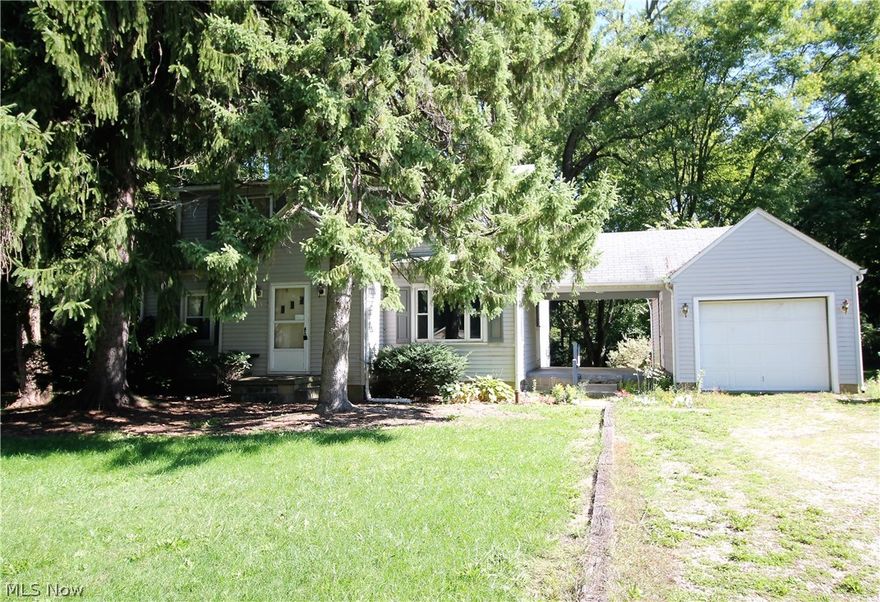 Endless possibilities right here with this three bedroom, one full bath home on almost an acre lot. This home has plenty of charm that just needs someone to use their personal touches. The large living room has wood floors under the carpet and is open to the eat in kitchen area. There are three bedrooms upstairs that all have wood floors under the carpet and a full bathroom. The large fabulous wooded backyard has plenty of room for entertaining, relaxing and just enjoying, there is also a shed for all your outdoor tools etc. There is a unfinished basement. Also there is a one car garage that has a covered walkway from the home to the garage, and enough room to be used as a covered patio. Precious memories start right here!