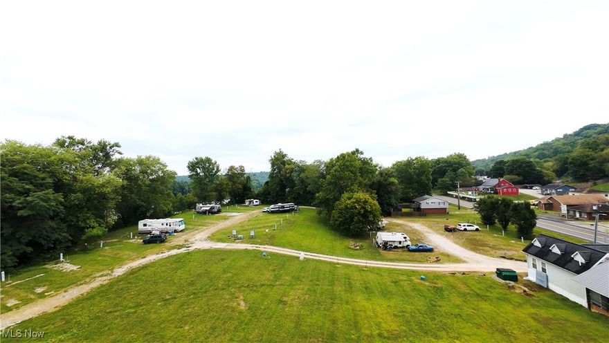 Awesome opportunity to own a private campground on 14 +/- acres situated along the beautiful Ohio River in Belmont, West Virginia!  A favorite of locals and travelers alike, Blue Heron Hideaway consists of 28 camp sites, each with full electric and city water/sewer hookups. Generate additional income by utilizing or leasing out the commercial restaurant space (formerly a hot dog shop) with a large covered outdoor eating area. Your campers will be delighted by the convenience of a Dollar General Store situated on the property and a 7+/-  acre backwater inlet for fishing, kayaking and recreational enjoyment. Don't let this one pass you by- schedule a private tour today!
