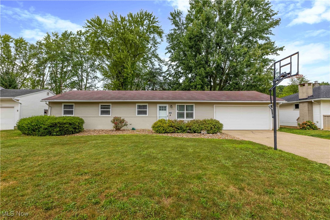 WOW! This stunning Elyria Township ranch checks every box—modern, stylish, and move-in ready! Step inside and you’ll instantly feel at home with its spacious open-concept layout, beautiful vinyl flooring, recessed lighting, and a cozy built-in electric fireplace. The gourmet kitchen will impress with rich espresso cabinetry, tile backsplash, center island, and stainless steel appliances. A bright dining area with sliding doors opens to your fenced backyard oasis—perfect for summer nights on the repurposed deck! Enjoy the ease of one-floor living with three generous sized bedrooms, 1.5 updated bathrooms loaded with designer touches, plus a convenient first-floor laundry/mudroom right off the garage. The attached 2-car garage with extra storage space and bonus storage room inside provide all the room you need for bikes, tools, or hobbies. Recent updates give you peace of mind: electrical (2025), deck, shed, storm door, ceiling fans, water tank (2024), privacy fence, furnace, A/C, fridge, and dishwasher (2021). All of this on a quarter acre lot in a prime location just minutes from I-90, the Turnpike, shopping, and dining. This home is truly a must-see—schedule your showing today before it’s gone!