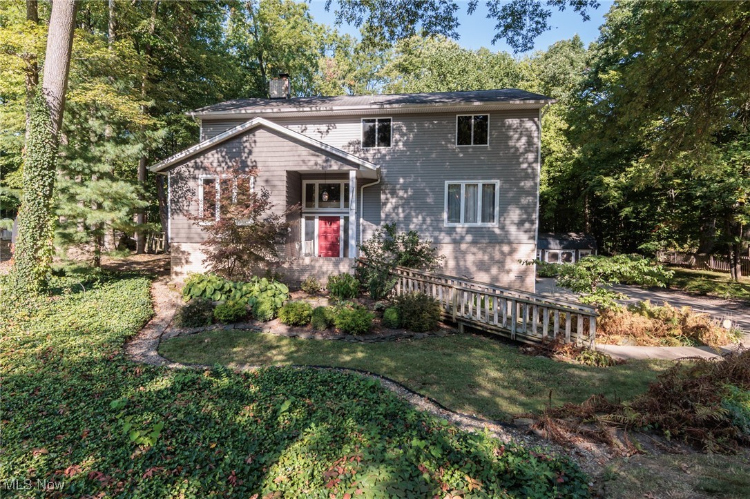 Discover this one-of-a-kind contemporary Colonial tucked away on a private .53-acre property in Strongsville’s sought-after Co-Moor community. A nature lover’s dream, this home combines serene surroundings with an abundance of living space with over 4,200 square feet of thoughtfully designed rooms for everyday comfort and entertaining. Step inside to a welcoming living room featuring a cozy fireplace and impressive patio doors framing views of the picturesque backyard. A formal dining room opens to a spacious kitchen with generous cabinetry, ample prep space, a pantry, coffee bar, included appliances, updated flooring, and a bright dining area with a sliding door to the sprawling deck, perfect for outdoor gatherings or peaceful mornings. Adding to the homes appeal there ae multiple spaces for the whole family to enjoy including the comfortable family room, a versatile game room, a workshop off the oversized 3 car garage, and a bonus room off the primary suite, an ideal space for an office, nursery, or craft room. Two half baths ideal for guests & a large laundry room. Upstairs, four bedrooms & two full baths offer room for everyone. The park-like backyard invites relaxation with its firepit area and storage shed, an inviting spot for cool autumn evenings spent roasting marshmallows with family and friends. Updates include new siding (2017), gutters (2018), deck (2018), shed (2021), and a new furnace and A/C (2025). Enjoy all that Co-Moor has to offer, from its community pool and recreational amenities to its convenient location near schools, shopping, restaurants, quick interstate access and Strongsville’s beautiful Metroparks. This property blends privacy, space, and an active neighborhood lifestyle, making it a truly special place to call home.
