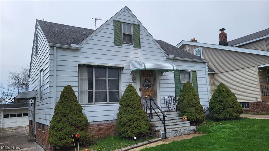 Aluminum Sided Bungalow, 3 bedrooms, 2 baths, eat-in kitchen, all appliances stay, hardwood floors, newer furnace, rec room, shed, 2 car garage w/opener