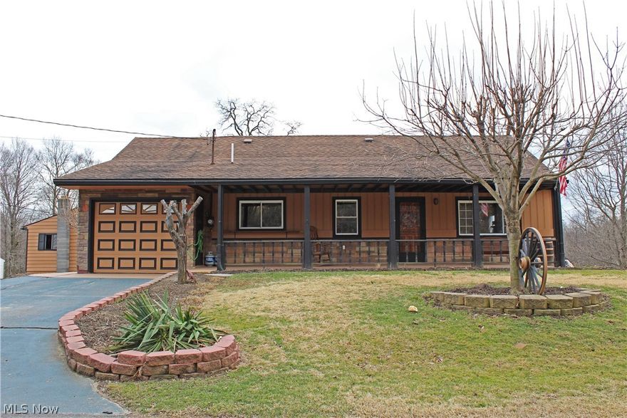 If unique is what you seek, prepare to be impressed with this 3BR home in a true country setting! Enjoy your own private waterfall from multiple viewpoints, including two separate decks and sunroom. House features a modern style kitchen, living room and dining room with access to garage. Second building offers workshop area and second garage. This really is an acre of paradise! Call today to schedule your private tour.