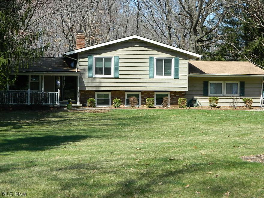 Country living at it's best in Macedonia. Spacious 4 bedroom split level nestled on wooded acre lot. Hardwood flooring through out, updated bathrooms and multi level deck off kitchen and master bedroom. Family room with fireplace and slider out to patio. Fresh and vibrant home that has been well maintained over the years. Windows all new in 2010, roof new in 2006, freshly painted, electrical pet fence. Shed and huge back yard, Excellent rated schools and close access to major highways (271/480).