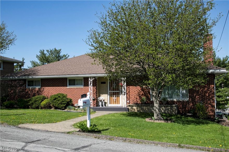 Lovely, cozy ranch style home, custom built brick ranch situated on corner lot.  Original owner. This home has 3 nice sized bedrooms and ample closets; finished lower level with walk out, bar & half bath.  Hardwood floors on main level under carpeting. One car integral garage and an additional detached garage with additional storage.  Home has been inspected; report can be viewed.  Also includes a Home Warranty.