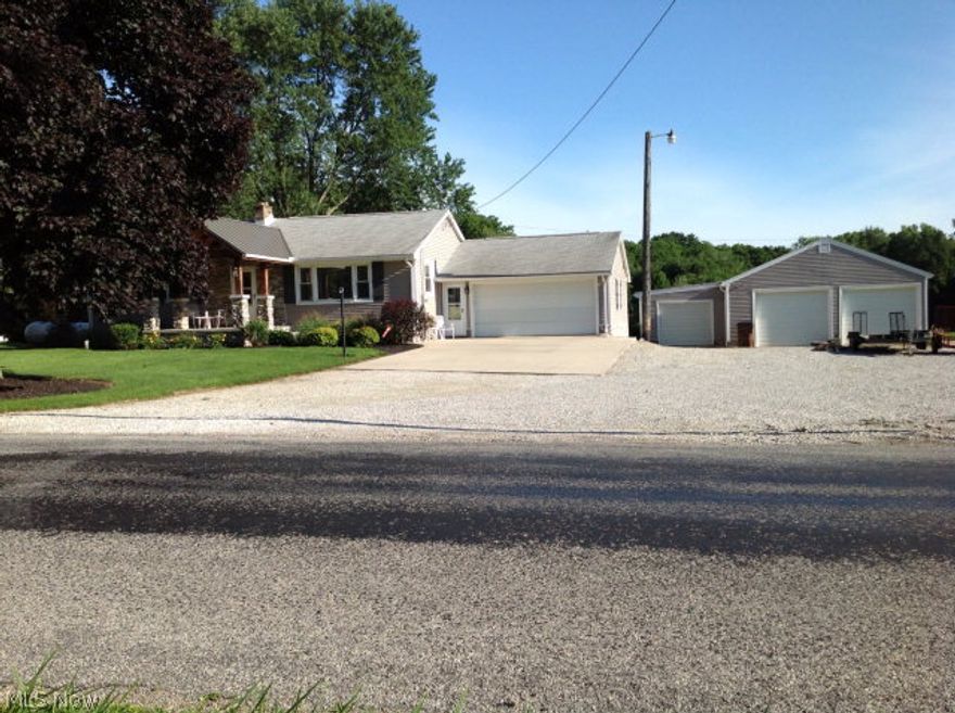 Relax and enjoy the view from the back patio of this updated 3 bedroom ranch. Great 2.28 acre lot with landscaping that's already done. Fantastic kitchen offers tile floors, cherry cabinets, granite countertops, and Dovetail Drawers by Medallion. Large family room in the basement. Attached 2 car garage and 3 car detached garage.
