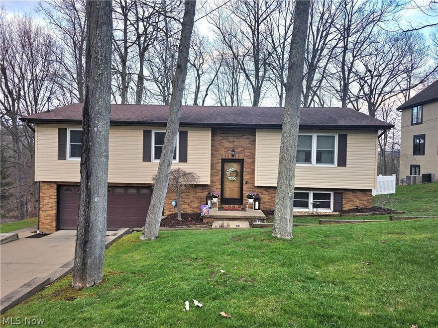 Welcome to this beautifully updated 3-bedroom, 3-bathroom, split-entry home offering the perfect blend of comfort and style.  Tasteful and modern updates throughout create a warm, move-in ready space you will love.  The open floor plan provides plenty of room for everyday living and entertaining, including a finished lower-level family room - ideal for whatever you need.  An oversized 2-car integral garage adds convenience and extra storage.  Step outside on the new back deck or the patio under the deck to enjoy the large, fully fenced back yard.  Roof system installed on deck so when it rains, water goes into a gutter and the patio under the deck stays dry.  Permanent Christmas lights recently installed.  With generous living space, modern updates and great outdoor space, this home checks all the boxes and won't last long!