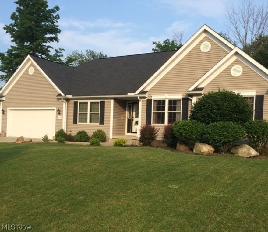 As you enter this beautifully maintained home  you will see a spacious great room with a high vaulted ceiling and full stone corner fireplace.  The great room opens into a large kitchen with dining area.  The built in desk adds a lot of extra storage and a perfect place for your computer.  The walk in pantry is wonderful for storing all the food and more.  This kitchen design is perfect for the cook in the family and also a breakfast bar for additional stools.  As you enter from the garage, you enter into a mud room with built in's.  There is a covered deck with stamped concrete patio and a secluded back yard.  The master bedroom is spacious with a trayed ceiling, walk in closet, garden tub with separate stand in shower.  The other two bedrooms are good size too.  A first floor laundry is always a plus and this one has built in cabinets and folding station.  Basement is full and open with high ceilings and ready to be finished.  In the development there is a fishing pond.   The locatio