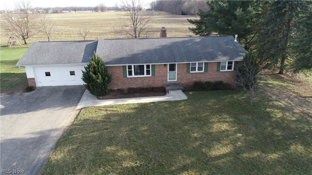Conveniently located on the outskirts of Kidron, this 4-bedroom 3-bath home is perfect for that growing family. On a 1/2-acre lot with picturesque views toward the north and a field behind which offers plenty of privacy. It also has a spacious concrete patio in the backyard and an attached 2-car garage. Featuring 1400 sq. ft. on the main floor it has a desirable, open floor plan. On the main floor are 3 bedrooms including the master suite complete with its own full bath. There is a full basement finished with beautiful wood panel-ing, including a full bath and additional bedroom. The utilities to the property are private well and city sewer, electric heat & Natural Gas fireplace in the basement, and Natural Gas hot water heat.