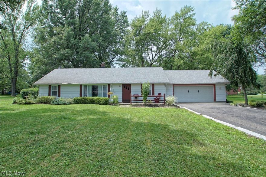 Are you looking for one floor living with an attached two car garage and a large outbuilding in lovely Rootstown? Look no further than 3917 New Milford Rd! This three bedroom, one and half bathroom home sits on .83 acre of land. This home has an updated kitchen complete with granite and plenty of space! The kitchen opens up to a large family room/den complete with a brick fireplace with a wood burning insert. Off of the family room is a spacious three season room that opens to a patio. This home has three spacious bedrooms, updated baths, new carpet & fresh paint. Carrier high efficiency furnace, new hot water heater, dual water softener system and an 5 year old roof. This house is MOVE-IN ready. Situated behind the home is a large 24x30 building complete with concrete floors, electric, Reznor overhead heater and water and a driveway to the building!  The sellers are currently in the process of tying into the city sewer - just waiting on final permit from the EPA so that work can be started.