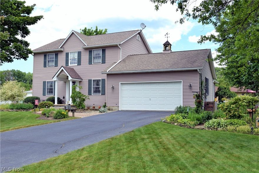 This lovely two story 3 bedroom and 2.5 bathroom home offers high style country contemporary living quarters. A rich flooring pattern of tile create a bespoke look that fills the two story foyer and offset kitchen areas of this home. A mix of hardwood and large tile flooring separate formal living and formal dining rooms along with the traditional kitchen space. Brightly colored walls and wood trim work follow suit into the tailored updated kitchen where granite counters offset the stainless appliances and wood cabinetry. A large carpeted family room offers a gas fireplace inset into a wooden mantle while a raised peak ceiling provides extra room for an open feel.  The updated first floor half bath is trimmed nicely with woodwork. Up the carpeted staircase you will find the three bedrooms, each equally exuding high craftsmanship in their appearance. The large master bedroom offers a walk-in closet and stunning updated master bath with glass wall shower and tile surround. Two additional