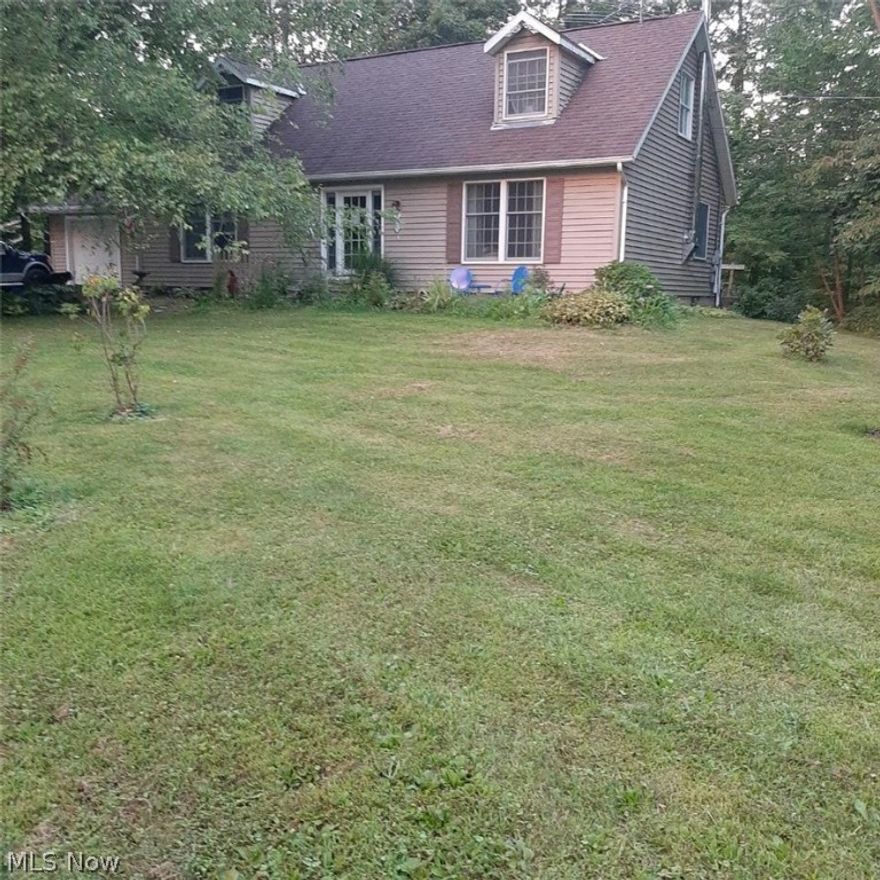 Make your escape to the private backyard encircled with trees, new porch, & hot tub. 3 bedrms, master on main level with attached glamour bathrm, and a second half bath on the main level. Second floor has 2 bedrms -- one makes a wonderful guest retreat with in-room deep soaker tub & shower or make it your second master suite -- also a half bath up. A revitalized home throughout. Laundry rm & master bedrm on 1st floor. Large kitchen w/plenty of cabinets & custom center island. Main bathrm w/large walk-in shower. All appliances stay. Clean full basement with built-in shelving & cabinets. Basement has 2 ways of egress. Vacant lot 5070 Sangria Dr. included. Cinnamon Lake is located in the scenic heart of Ohio Amish country. Situated in the Northeastern part of Ashland County just outside of West Salem. Developed in the mid 1970's, over 1200 acres encompass the private development which includes over 200 acres of common areas and a 135 acre lake. Amenities include a 4,500 sq. ft. lodge, a b