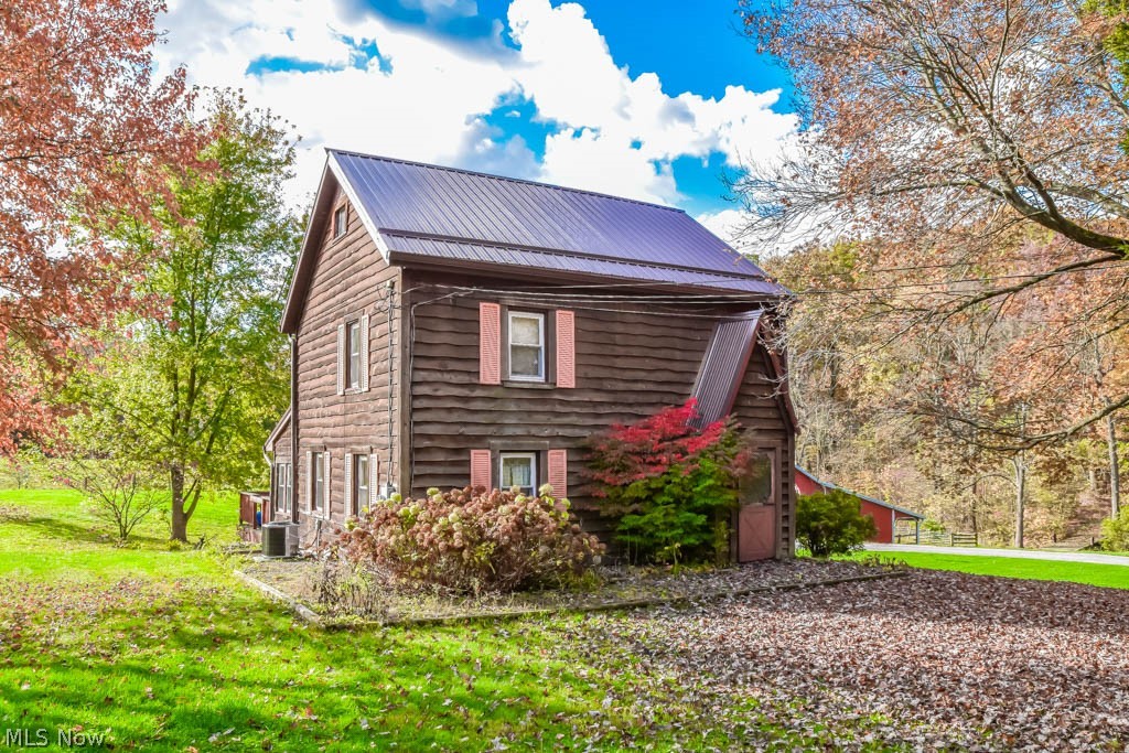 Originally built in 1840, this 3 bedroom farmhouse sits on 11.38 acres! Great for horse lovers with a 4-stall bank barn and fenced pasture, this property even connects to the TriCounty Horse Trail! The barn has an upper area with a 2-car garage door that provides ample storage. New foundation with 2 steel beams runs underneath. Each stall is 12x12. Car enthusiasts or hobbyists will love the 48x36 garage with an additional 24x24 garage on the back. It offers space for 9 vehicles and an oil furnace - great workshop option! 200 AMP electric with underground electric to the garage and barn. Inside the farmhouse, you’ll love the distressed hickory flooring in the living room and first floor master bedroom. Eat-in kitchen with a dinette and sliding doors to the screened-in porch. Full bath on the main level. First floor laundry room, too! Upstairs, there are 2 bedrooms, a nice-size loft plus a walk-up third floor attic finished for extra living space. Back porch and deck overlooking the acre