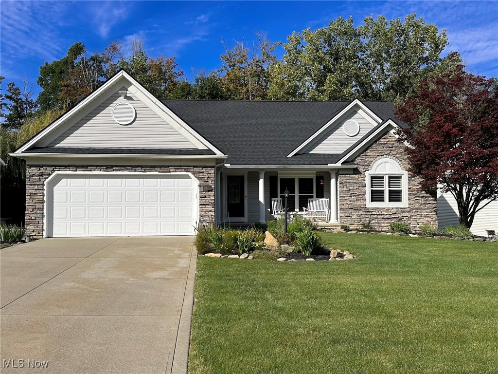 WOW!!!! This COMPLETELY RENOVATED Ranch in the highly sought-after Stone Creek Community is stunning, inside and out! Upon arriving you’ll be welcomed by a charming covered front porch, a beautiful stone façade, and professionally designed landscaping with sprinkler system that completes the picture-perfect setting. Step inside to find an open and airy floor plan with vaulted ceilings, brand-new wood floors throughout, and freshly painted neutral walls that make it look and feel like a NEW CONSTRUCTION HOME.
The formal dining room with plantation shutters is ideal for hosting gatherings. The eat-in kitchen has beautiful white cabinets, granite counters perfect for bar stools, a walk-in pantry, and a spacious eating area. It opens to the Great Room, where large windows frame endless views of the private wooded backyard. Sliding patio doors lead to a composite two-story deck, perfect for coffee/wine moments. Off the Great Room you’ll find a renovated full bath and two bedrooms, completely renovated.
The Master Suite, privately located on the other side of the home, is a true retreat, featuring vaulted ceilings, a cozy sitting area, and dual closets leading to a beautifully updated Master Bath. Enjoy a tiled walk-in shower, new vanities, fixtures, plantation shutters, and ceramic flooring. A first-floor laundry with sink, cabinetry, tile floors, and ironing board adds convenience.
Downstairs, the walk-out lower level is spectacular: and has huge family room, built-in wet bar, and sliding doors to a stamped concrete patio with outdoor gas grill, granite counters, and covered sitting area. The wooded yard offers a magical backdrop. The lower level also includes a new 4th bedroom with walk-in closet, a half bath (shower-ready), workshop, and abundant storage—ideal for an in-law suite if needed. Invisible fence included.
Updates: A/C 2020, Furnace 2024, Windows 2022, Roof 2021, Wood Floors 2024, Bathrooms 2024.