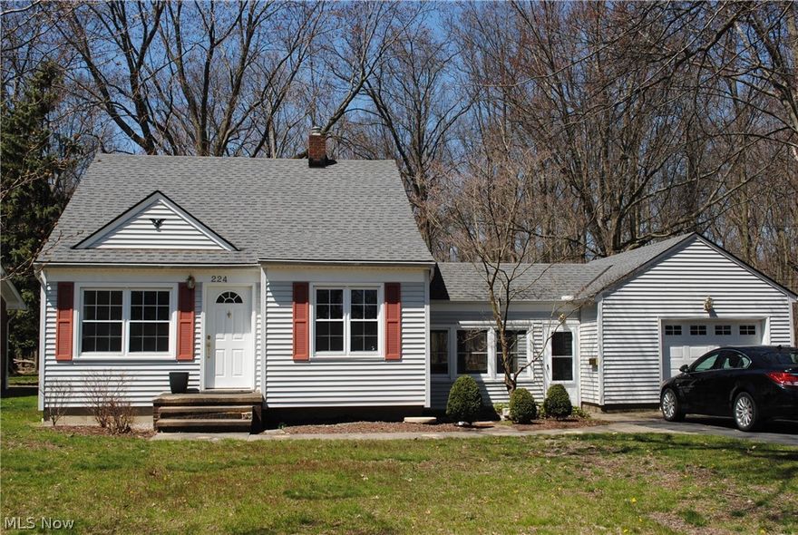 Charming Cape Cod on a great lot that backs to woods will impress.  Remodeled kitchen is eat in with all appliances that stay.  Updated bathroom.  2 bedrooms down and 1 upstairs.  Breezeway attaches 1.5 car garage.  Vinyl siding.  Updated windows.  Basement has been waterproofed and offers partially finished recreation room, workshop area and laundry room.  Brick patio is the perfect place to enjoy the outdoors.  Wonderful private yard with shed.  Call today.