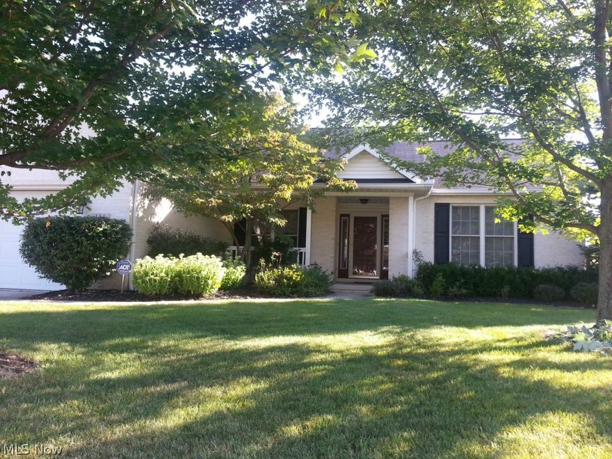 All brick ranch in the Midview school district! Very clean and move in ready. As soon as you pull up you will see the quality and feel at home.  Beautiful landscaping welcomes you as you walk to the front porch.  As you enter the house the Great Room with the hardwood floor, beautiful stacked stone fireplace, raised ceiling and windows invite you in.  The hardwood flooring continues to the kitchen.  In the kitchen there are loads of cherry cabinets, natural stone backsplash and clean Corian counters.  Many cabinets and the island have pull outs.  Kitchen also has a built in desk.  Stove is electric and has a gas connection already available.  All kitchen appliances are stainless steel.  Dining room with tray ceiling also has hardwood flooring.  Master bedroom a true retreat with lots of space and the master bath all new in 2013 with a jetted tub, tiled shower with frameless glass doors, custom ceramic flooring, vanity with granite counters and double vessel bowl sinks. Walk in closet with custom built ins, you will find room for everything!  When you walk into the back yard you will know you won't want to leave.  Covered back porch with ceiling fan.  Backyard completely fenced with wooden fencing. There is a large pool to enjoy and a deck connected to the pool.  Backyard still has plenty of room to relax and enjoy.  Call for your personal viewing!