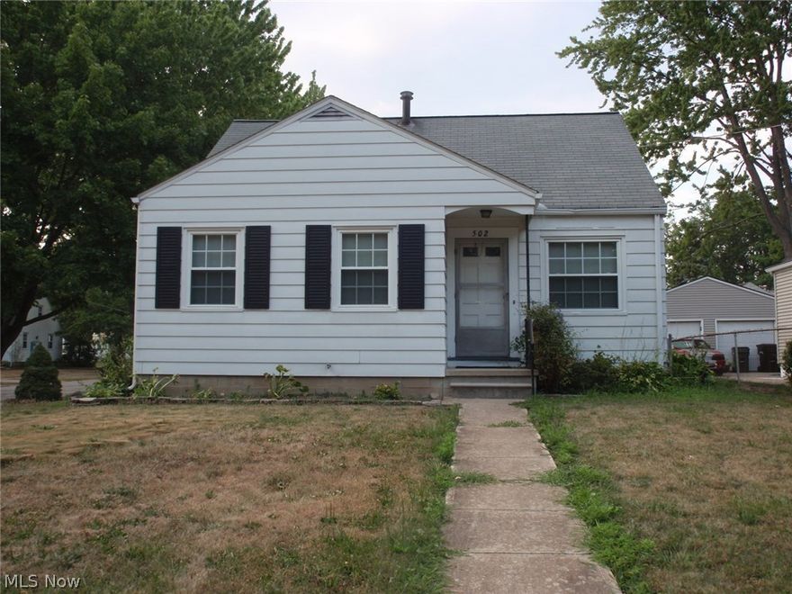 Aluminum sided bungalow in the popular Eastern Heights Subdivision.  Interior has been freshly painted, has vinyl replacement windows and beautiful hardwood flooring. Nice and clean - move in condition.  Bathroom has ceramic tile on  floor and walls and a shower over the tub.  Full basement has glass block windows and can be easily finished for additional living space.  Second floor features natural wood floors, plenty of storage space and bedroom.  Home is conveniently located within walking distance of hospital, schools, recreation center and convenience shopping.  There is a rear, sandstone patio along with hard rock water feature and decorative pond and lots of perennials and shrubs creating natural privacy.   Washer, dryer, range and stainless refrigerator with ice maker and filtered water dispenser are included with home.  There is an electric line dedicated for the addition of a dishwasher.  Detached garage was freshly painted in June '16 and has electric door opener. Chain link