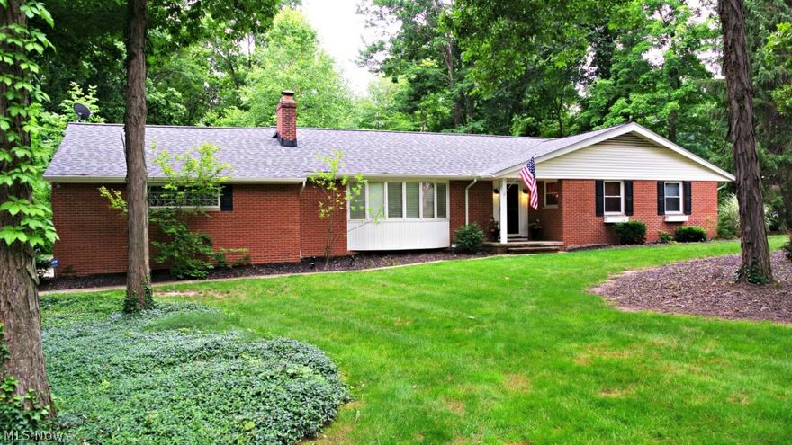 This classic, 3 bedroom, brick ranch sits on a grassy lot, nestled among mature shade trees on a quiet, dead-end street near the center of Brecksville. Inside, the home has been transformed into a more modern and open space, with remodeled Kitchen and Baths, contemporary colors, and upgraded finishes. Front entry opens to slate Foyer with generous guest closet. Large Living Room spans the front of the house. Graceful bow window adds volume and light. Wood burning fireplace is an attractive focal point. Formal Dining Room is open to Living Room & gorgeous Kitchen. Custom Kitchen remodel with maple cabinets, ss appliances, tile back splash, and cherry flooring. Hardwood floors in all 3 Bedrooms. Master Bedroom offers walk-in closet and its own Bath. Spacious covered porch and brick patio in back. Other updates include: New Roof (tear-off) - May 2015, Furnace & AC - 2012, Remodeled Baths - 2010. 1-yr Home Warranty included. Close to Community Center, Library and other city amenities!