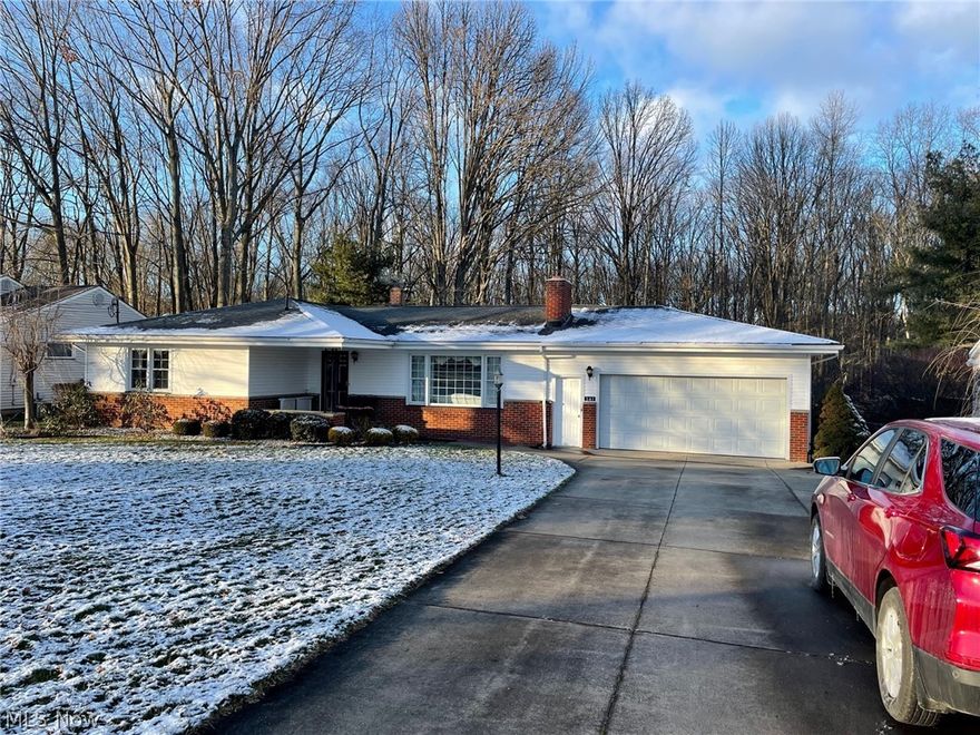 What a gem! Custom built ranch on large lot features 3 bedrooms, 2.5 baths, living room w/woodburning fireplace, newer oak kitchen w/plenty of cabinetry, family room opens to private cement patio, finished basement that has been waterproofed & 7 car garage. Updates: furnace & windows 2002, roof 2007, central air 2008, 200 AMP breaker box 2007, oak kitchen 2002 & waterproofed basement. Added features: 5 car detached garage that is insulated, has woodburnig stove, running water & electric. 3 bar stools in kitchen stay. Back of property abuts woods, very private.