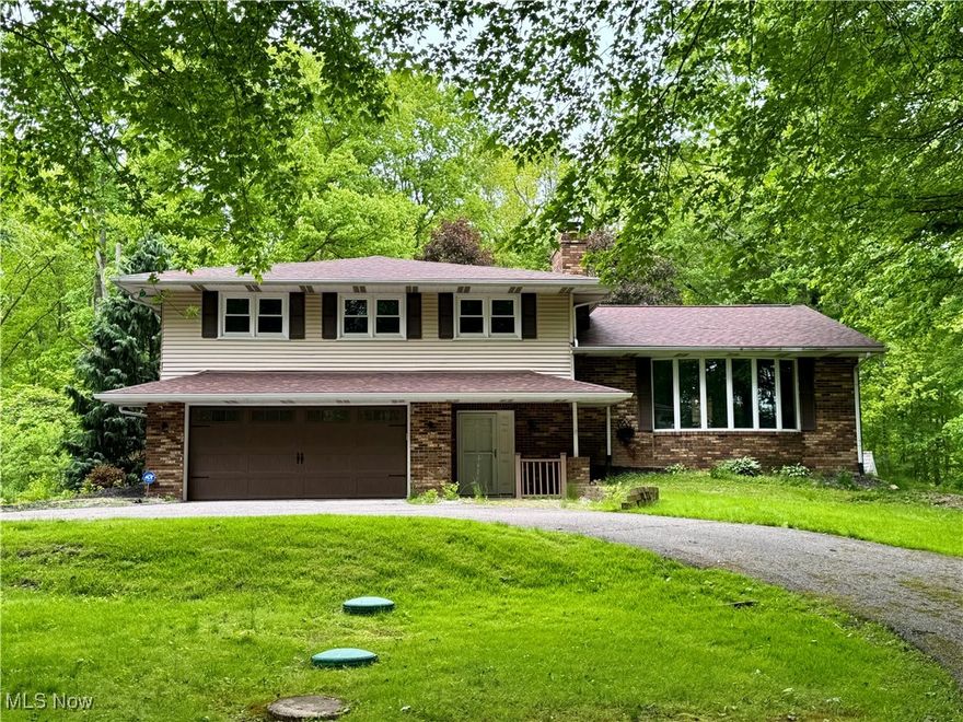 Welcome home to this private retreat nestled on 2.99 acres.  This three bedroom, 2.5 bathroom home offers so much potential with its walk out deck/patio area leading to an inground pool.  The 48x80 shop; outbuilding is a showstopper with its enormous heated space!  Bring your own TLC and finishing touches to make this home stunning!  Outbuilding lifts do not convey with property.