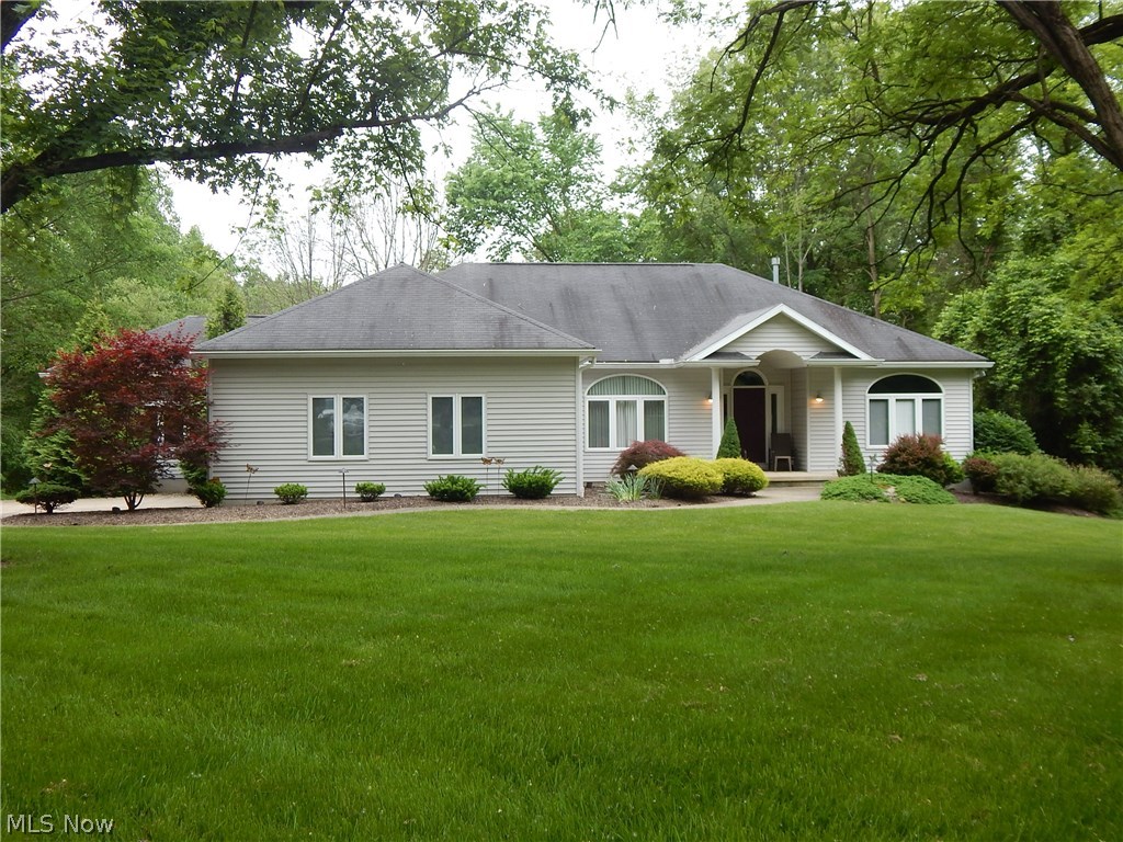 Perfect for the buyer looking for retreat. Beautiful rolling 2.06 acre parcel with all city utilities. Magnificent sprawling ranch built in 2000. Ranch style home featuring oversize master suite with walk in closet over size master bath. Opposite side of home features additional 2 Bedroom and bath, lower walk out offers 4th bedroom and full bath. Possible in-law suit set up. Full size bar, entertainment area and yes the pool table stays with the house.
Vibrant 9' ceilings on first floor, huge dining room over looking lush landscaped front yard. Home sits off road with winding concert drive to side entry garage.
The home is a true Oasis in the city. Convenient location to parks, the valley running and walking trail. Near Portage Crossing for shopping and dining.
This home is very unique for the buyer looking for space, yard, and a convenient location.