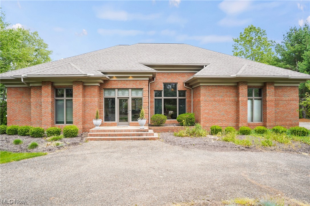 Welcome to 7177 Colonial Hills Drive, a captivating residence nestled in the charming community of Sharon Township. This one-of-a-kind architect-built and owned walk-out Ranch features 5 bedrooms and 3.5 bathrooms with over 5,000 sq ft of living space on a spacious 2-acre lot. Upon stepping through the front door, you'll be greeted by an elegant foyer that sets the tone for the rest of the home. The residence offers a seamless flow between its living spaces, providing the perfect setting for both relaxation and entertainment. The large living room has a cozy fireplace and large windows that give way to scenic views of the outdoors. The adjoining dining area is ideal for entertaining intimate gatherings and family dinners. Enter the modern kitchen with stainless steel appliances, granite countertops, and stylish cabinetry. The primary suite is a tranquil retreat, complete with an ensuite bathroom offering two separate showers, dual closets, and vanities. As you head downstairs to the walk-out basement there are 2 generously sized recreation rooms, 2 additional bedrooms, and a full bathroom. This property enjoys easy access to nearby amenities, including shopping centers, schools, parks, and recreational facilities. Don't miss the opportunity to own this remarkable residence! Schedule your private tour today.