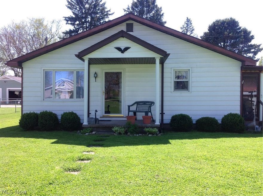 Ranch with three bedrooms, large living room, with enclosed breezeway, attached 2 car garage plus carport for RV or Boat.  Gas heat, central air.  Family room with bar and laundry in basement. Refrigerator, stove, microwave, washer/dryer to stay.   All window treatments to stay.  Living room has hardwood under carpet.  Hard wood floors in bedrooms and dining room.    Washer and dryer could be moved up to first floor.