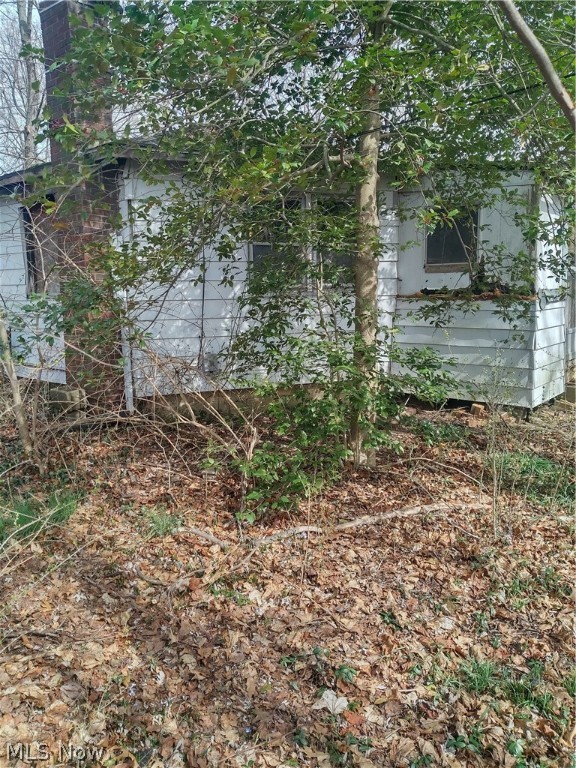 Great private location, on a no outlet street in Green schools! Close to everything, but away from all the hussle and bussle! Home was involved in a fire and is in need of extensive repair. It could make a nice small home renovation, with its unique octagon style, or would be a beautiful property to build the home of your dreams!