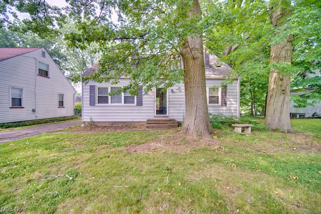 Charming 3 bedroom, 2 full bath cape right in the heart of Cuyahoga Falls features two first floor bedrooms along with a full bath. Hardwood throughout the first floor can be found under the carpet. Off the dining room is a lovely deck over looking the fenced in back yard and one car detached garage. Upstairs is the oversized 3rd bedroom with hardwood flooring and a walk in closet. Down in the basement is the 2nd full bathroom along with laundry and a rec room that could be used as a 4th bedroom. Located near downtown Cuyahoga Falls, Portage Crossings, Route 8, hiking trails and more! Schedule your showing today!