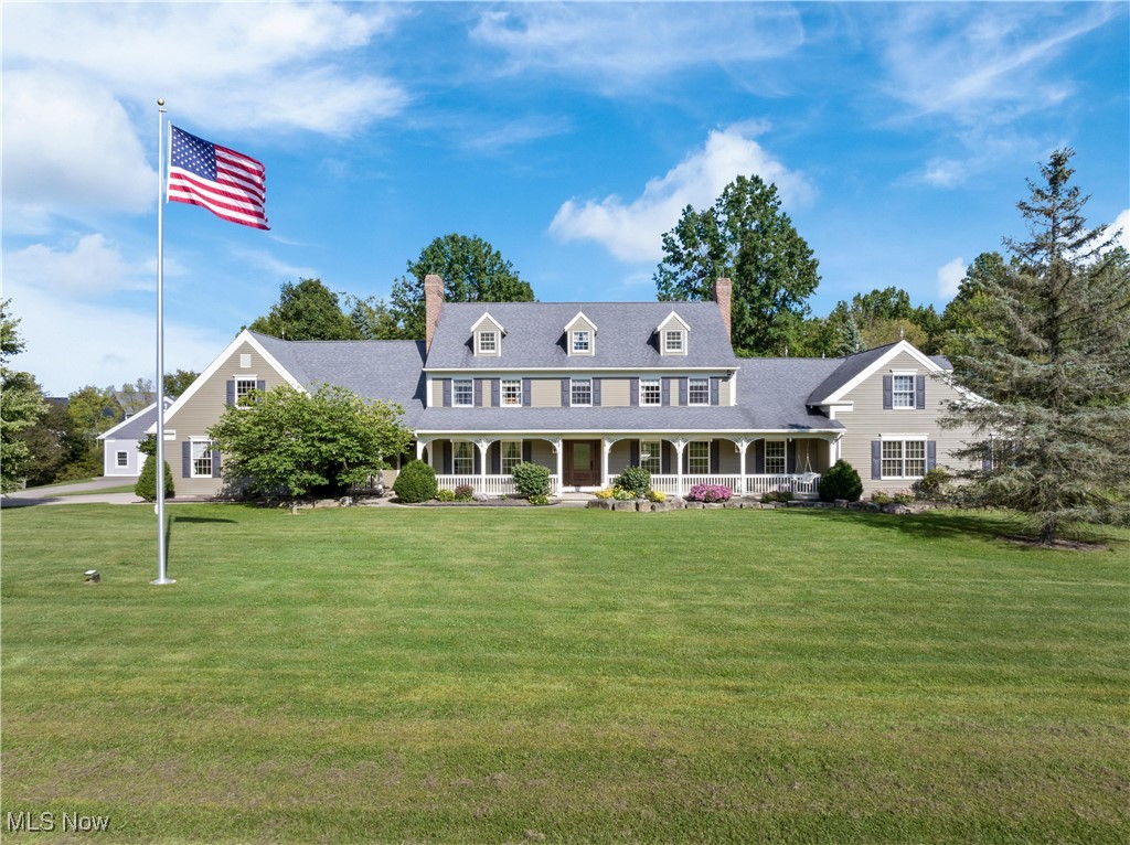 Welcome to a truly exceptional estate nestled on nearly 11 acres in the heart of Wadsworth Township. This stately Cape Cod offers over 6,400 square feet of meticulously maintained and thoughtfully updated living space, featuring 4-5 bedrooms, 3 full baths, and 2 half baths. The home's design and finishes blend timeless craftsmanship with modern luxury. The main level boasts a spacious primary suite with a stunning ensuite bath and walk-in closet, along with rich natural woodwork throughout, beamed ceilings, and two cozy fireplaces that add warmth and charm throughout. The gourmet kitchen is a chef’s dream, offering granite countertops, custom cabinetry, a large island, breakfast bar, and built-in features—all seamlessly connected to formal and informal living areas perfect for entertaining. Upstairs, you'll find a second primary suite, additional bedrooms with walk-in closets, a guest bath and a vaulted bonus room offering endless possibilities. The walk-out lower level includes a massive recreation room with a full bar, built-ins, and fireplace, ideal for gatherings. Step outside to enjoy your private oasis featuring a heated saltwater in-ground pool, complete with diving board, surrounded by lush landscaping, a stocked pond, and scenic views of mature trees and open pasture. This horse-friendly gentleman's farm includes a 60x36 bank barn with plenty of storage for your "toys", a 15' wide x 10' tall overhead door & 5 horse stalls. Located within the Wadsworth City School District and just minutes from shopping, restaurants and easy highway access, this remarkable property offers peaceful country living with all the conveniences nearby. Don’t miss your chance to own this rare retreat that combines luxury, privacy, and natural beauty in one extraordinary package!