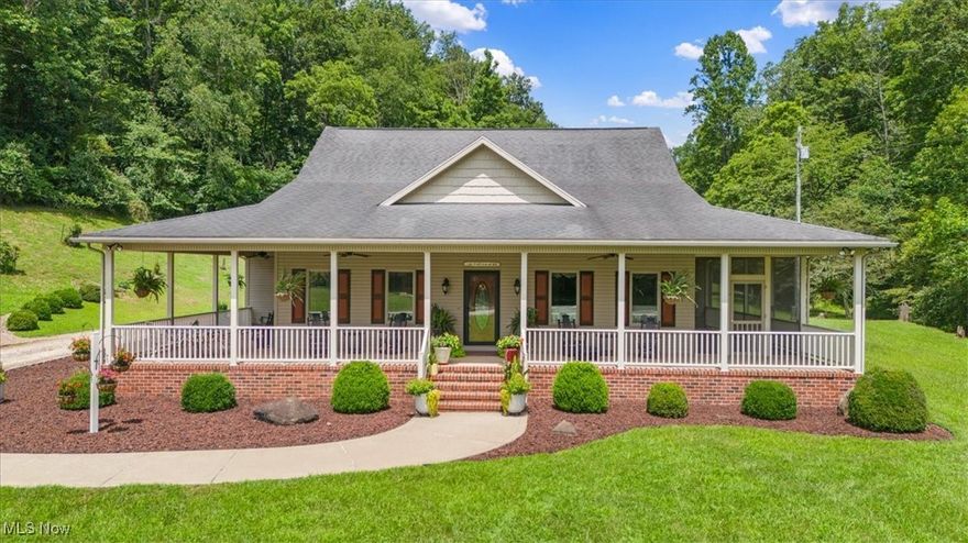 Park like 8.86 acre setting features ONE OWNER Rick Webb custom built retreat.  TOTAL ONE FLOOR LIVING includes open floor plan with fireside great room, gourmet style kitchen with stick built cabinetry and granite counters, dining bay, family room, nine/ten foot ceilings, owners ensuite and three guest rooms. Inviting wrap around porch, oversized Anderson Windows, fifty year roofing shingles, maintenance free exterior and free standing workshop. Tasteful decor and perfect updated condition. This must see home offer ADDITIONAL ACREAGE if desirable. Available today!