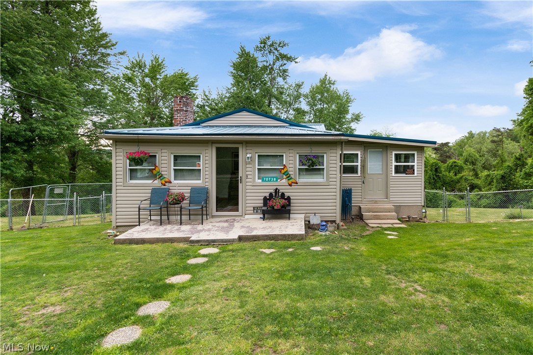 Quiet, cozy, country living! This adorable and well-maintained bungalow sits on a highly desirable lot on a very low traffic road, just seconds from US-250. Enjoy the yard space and sunroom in the warm summer months! Inside you will find a convenient and efficient floor plan. The living room features an electric fireplace with a beautiful stone accent wall. The metal roof is new as of 2020. Call today to schedule a time to view this lovely home in person!