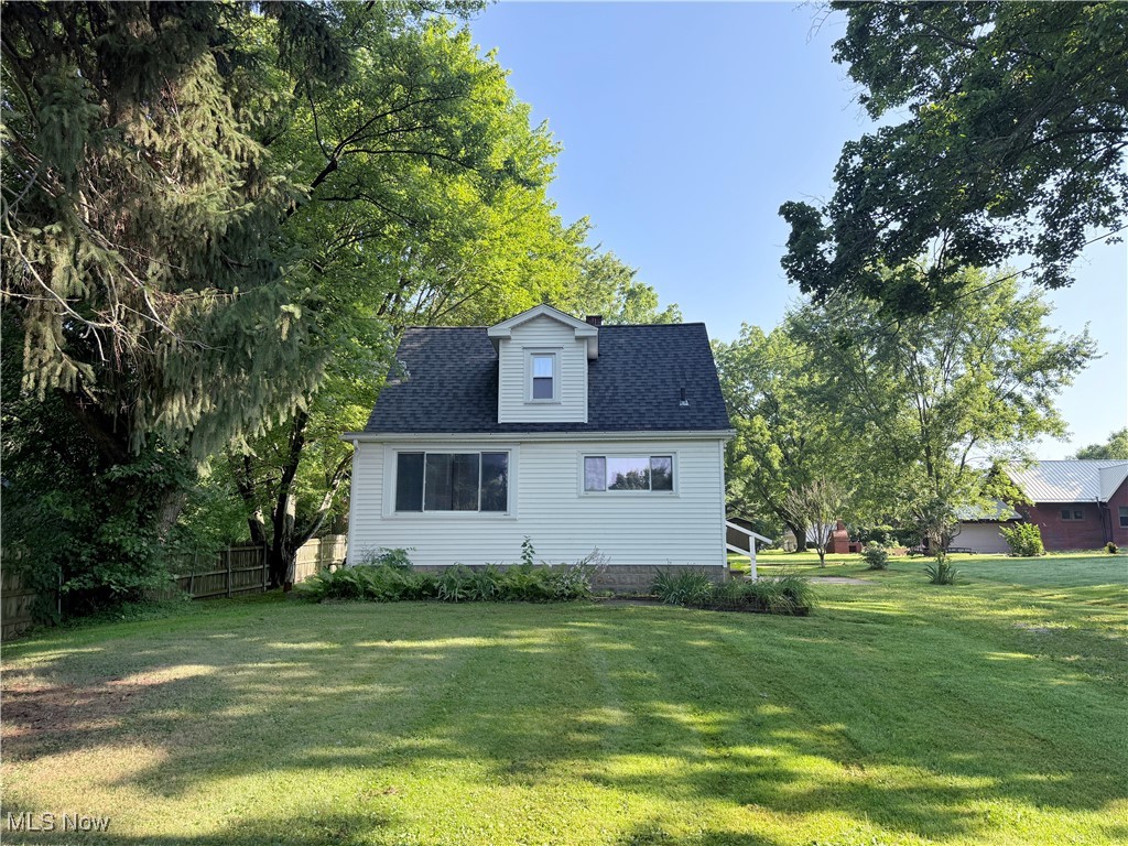 Check out this opportunity to own in Copley/Fairlawn Schools. Located just west of Akron and convenient to highways and shopping, this little Cape Cod is set back from the road and offers shaded tranquility and a large front yard. Featuring a first floor primary suite with a half-bath, this home also has built-in cabinets, a full basement with ample storage, and attached garage.