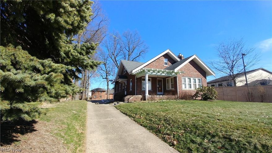 Beautiful all brick home with a spectacular amount of living space in quiet Harter Heights!  Home warranty included for peace of mind!  The first floor of this home features not only an updated kitchen, first floor laundry, full bath, bedroom, vast dining room and living room with fireplace, but also a sunroom with updated flooring and an additional office with french doors leading to the living room.  Crown molding, archways and hardwood add to the beauty of this floor. On the second floor you will find another full bath, an additional two bedrooms, one with double doors opening to the deck and stairs leading to the patio, and a kitchen that can be converted back to a fourth bedroom.  This floor has fresh paint and carpet, hardwood flooring underneath, along with a cedar closet and ample storage areas.  This home also provides a full basement and all brick garage that can easily house two vehicles with enough additional room to store a third vehicle, lawn and gardening tools, patio fu