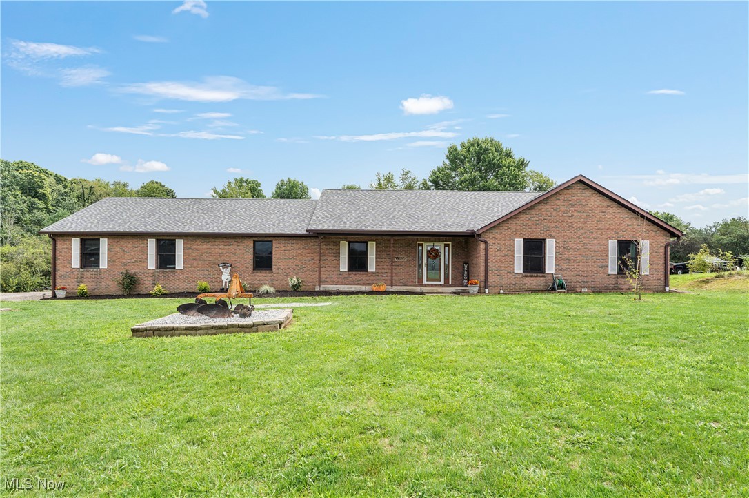 This charming brick ranch home offers 4 spacious bedrooms, 2 full Baths, and 2 half baths, all situated on a serene 5+ acre lot within the desirable Lake Local School District. Enjoy the ease of single story living with ample room in this open concept layout. This large master suite is a true retreat, featuring a spacious layout that offers plenty of room to relax and unwind. It boasts a huge walk in closet with easy accessibility. The master bath adds a touch of luxury, providing a private oasis with a large soaking tub, dual sinks and a separate shower. The open-concept kitchen seamlessly flows into a spacious great room, creating a perfect setting for both everyday living and entertaining. The kitchen features newer appliances, 2023=oven, microwave, Dishwasher, 2024= Refrigerator, 2022=Cooktop. The Enormous Basement Rec room is the ultimate entertainment hub, featuring a pool table and air hockey table for endless fun. Tucked away is a hidden "Harry Potter" closet, adding a touch of whimsy and extra storage or play space. A convenient half bath is also located in the lower level, making it the perfect spot for hosting game nights or relaxing with family & friends. The expansive property provides plenty of outdoor space for recreation or relaxation, with the potential for gardening, or even a small hobby farm. The above ground pool and its equipment remain with the home. There is a large clearing into the woods with a firepit, and there is a toboggan hill that is shared with the neighbors. They are at the top of the hill and this property is the bottom of the hill. This home combines the tranquility or rural living with the convenience of nearby amenities and excellent schools. New Roof February 2024, New Carpet in 2 bedrooms July 2024, Ohio Waterproofing and finished basement with half bath 10 years ago. New Furnace and A/C in 2016, water softener 2020, 1st floor flooring Fall 2023. Schedule your private showing today.
