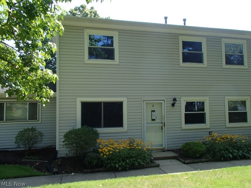 Adorable 2 bedroom end unit has newer laminate flooring in kitchen, dining and living room. Car port for parking and additional storage.