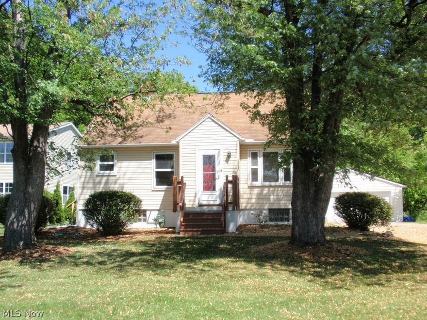 The open floor plan will be much to your surprise when you walk into this charming Cape Cod home.  The interior has been freshly painted and new carpet installed (2015).  The large living room is ideal for entertaining your guests and conveniently overlooks the kitchen and eating area.  There is a lots of counter space for the cook in the family to prepare those holiday meals to enjoy.  Appliances will stay.  The room off the kitchen can be used for an office/hobby/dining room, use your imagination to suit your needs.  A first floor bedroom and full bath round out the first level.  The entire second floor is finished and offers three closets and built in drawers.  This room could easily be split into two bedroom if needed.  There is a full basement with glass block windows and laundry hookups.  A two and a one half car garage is a big plus and driveway has turnaround.  This gem of a home is situated on a one acre partially wooded lot great for those outdoor games.  Home is minutes from