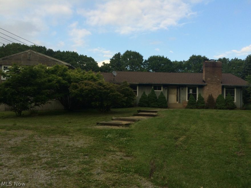 Gorgeous setting, just over 3300 sq. feet of living space, 4-5 bedrooms, 3.5 baths, living room with fireplace, basement, attached garage and more. So much potential. Very private.