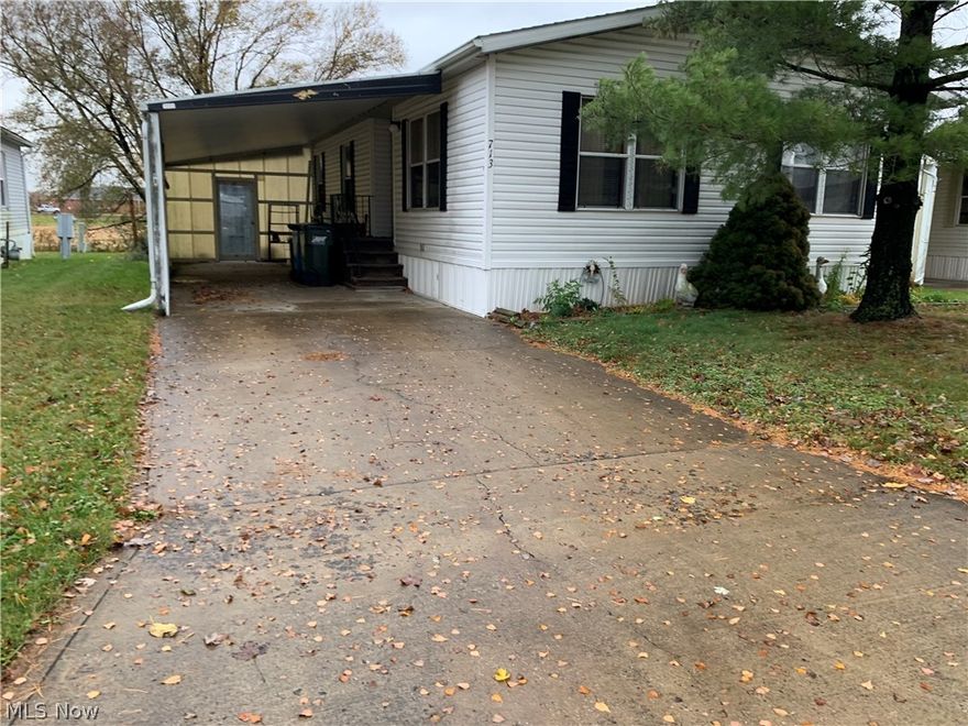 Welcome home to this well-maintained, affordable modular ranch home in a private setting that is  close to the amenities in the village of Wellington. This gorgeous home has an open floor plan with vaulted ceilings in the living areas and the master bedroom. The master suite has a spacious walk-in closet with a full bathroom. This gorgeous home also features a separate laundry and mud area that is located near the back door. The kitchen has a built-in cabinet in the dining area. This home also has a large storage shed in the rear of the property with your own private lot.