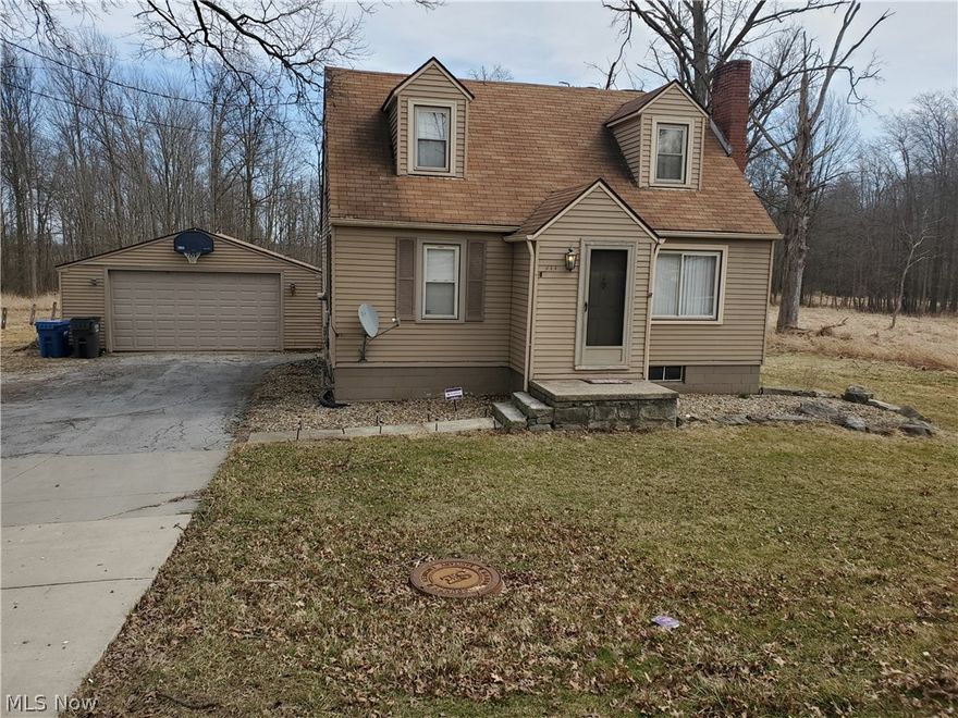 3 bedroom  bath Cape near I-80, eateries, businesses, Hollywood Gaming  much more. Updated bath 2013, newer carpet upper level, newer laminate flooring in living room & kitchen, newer garage door. Property being sold "as is" no repairs by Seller.